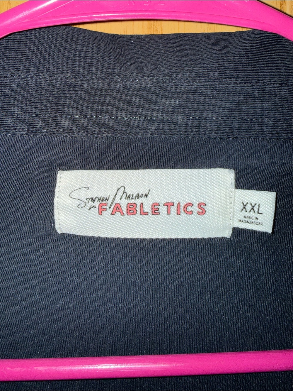 Fabletics Men's Polo in Black with Pink Logo Tag